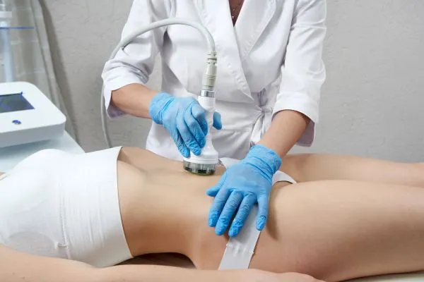 Lost the Weight but Not the Loose Skin? 2 woman having HIFU treatment on her stomach to combat loose skin Chelmsford following weight loss